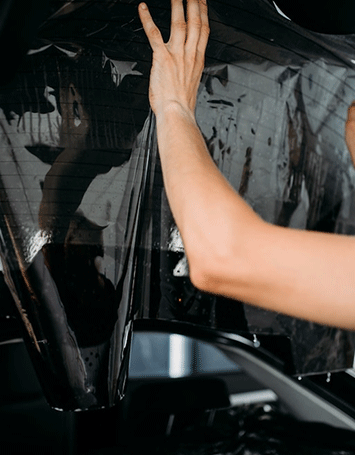 male-worker-applying-car-tinting