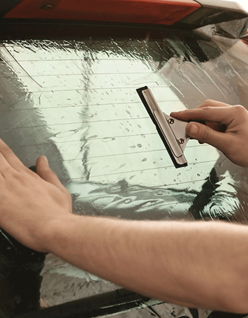worker-applying-tinting-foil-ont